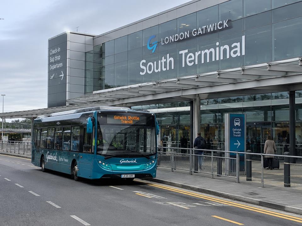 Gatwick Airport South Terminal exterior with a shuttle bus outside